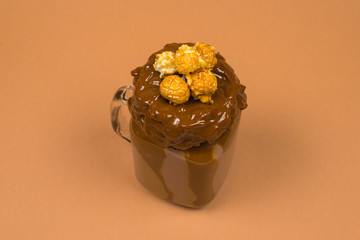 Chocolate milkshake with whipped cream, cookies, waffles, served in glass mason jar. 