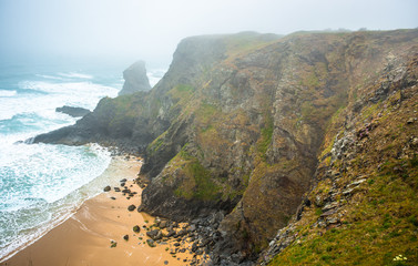 Bedruthan Steps on a foggy day, near Newquay