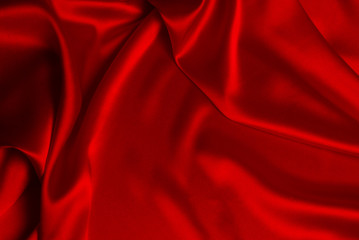 Red silk or satin luxury fabric texture can use as abstract background.
