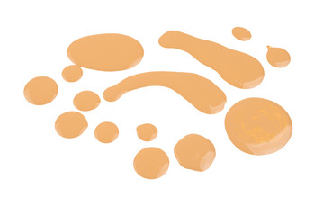 Liquid foundation swatch isolated on white background. Close Up of makeup cream sample.