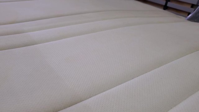 Dry cleaning of the mattress. Dry cleaning at home.Close-up.