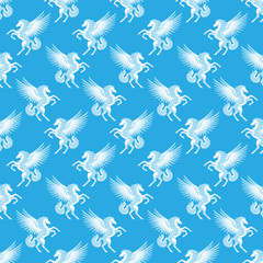 Seamless pattern with white pegasuses on a blue background.