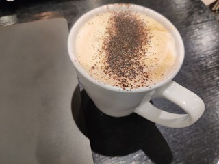 cup of coffee on black background