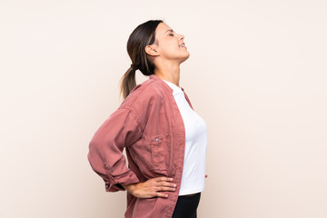 Woman over isolated background suffering from backache for having made an effort