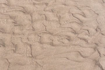 texture of sand in stream of water