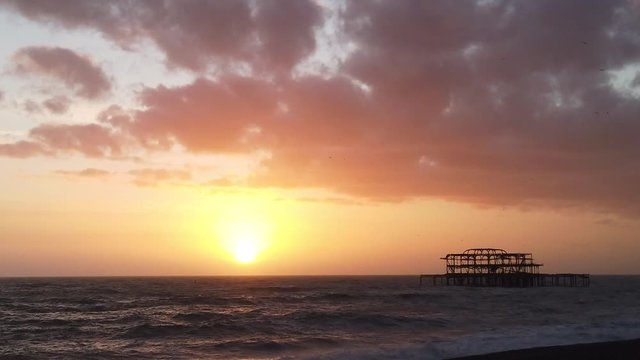 Silhouette of Brighton west pier at sunset