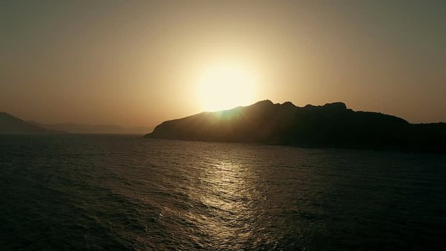 The greek island of Moni at the Saronic gulf. Aerial view during sunset