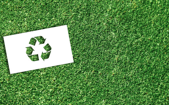 Recycle Sign on Green Grass