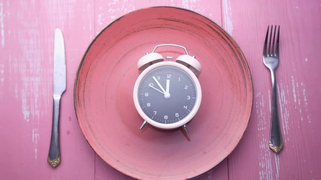 top view of alarm clock on plate