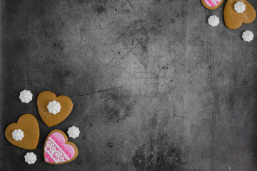 Mother's Day, Valentine's Day, Women's day.Banner of gingerbread hearts on a dark stone background with space for text.Poster for sale in the store.Postcard favorite..Spring festival.copy space.