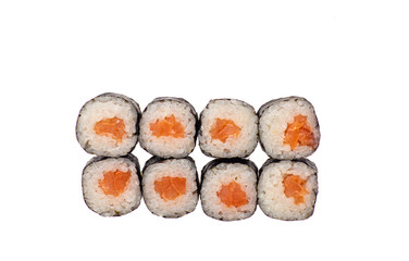 sushi and rolls with different toppings in eight pieces close-up on a white background top view