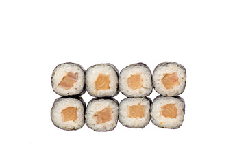 sushi and rolls with different toppings in eight pieces close-up on a white background top view