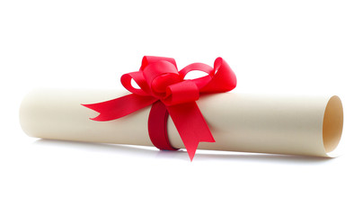 close up of paper scroll with red ribbon isolated on white background
