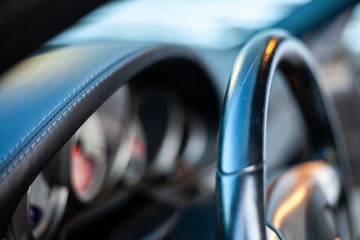 steering wheel and instrument cluster in modern looking car interior