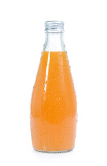 Orange juice in bottle isolated on white background