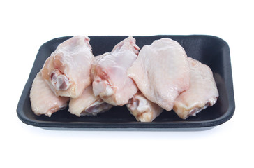 Raw chicken  on cutting board on white background