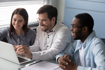 Caucasian man led meeting showing to diverse interns corporate app