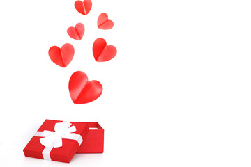 red present box with red hearts on a white background