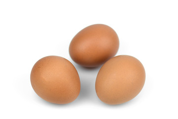 Three brown eggs separated with isolated from the white background