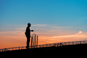 Construction worker using CB radio on a construction site,for construction teams to work in heavy industry