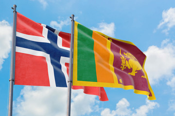 Sri Lanka and Bouvet Islands flags waving in the wind against white cloudy blue sky together. Diplomacy concept, international relations.