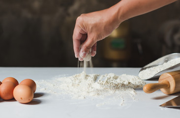 The chef is spinning the dough in the kitchen