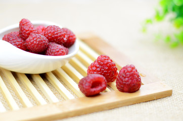 Purple raspberries in a porcelain plate