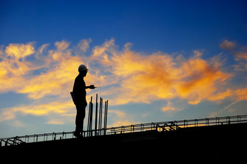 Construction worker using CB radio on a construction site,for construction teams to work in heavy industry