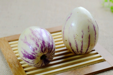 Two ginseng fruits on the bamboo mat