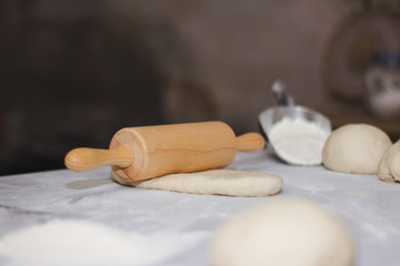 The chef is spinning the dough in the kitchen