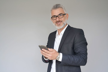 Businessman using smartphone, isolated