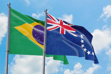 Cook Islands and Brazil flags waving in the wind against white cloudy blue sky together. Diplomacy concept, international relations.