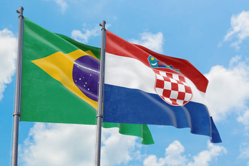 Croatia and Brazil flags waving in the wind against white cloudy blue sky together. Diplomacy concept, international relations.