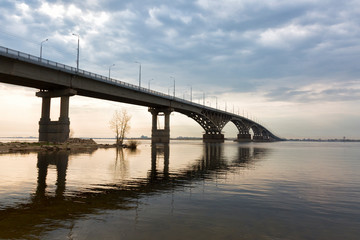Fototapeta na wymiar Bridge over the river Volga in sunset. The bridge connects Saratov and Engels. Russia