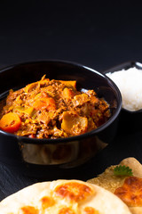 Oriental food concept spicy grounded or minced beefs masala curry with naan bread and rice