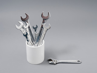 auto repair wrenches on a gray background