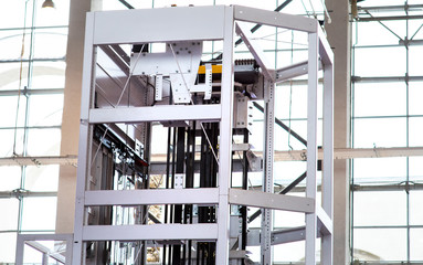 Elevator Installation, Lift Technician Installing a Modern Elevator