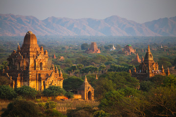 Sunrise over the valley with the ancient pagodas in Bagan