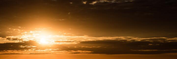 Sunset with clouds. Wide image