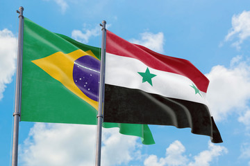 Syria and Brazil flags waving in the wind against white cloudy blue sky together. Diplomacy...
