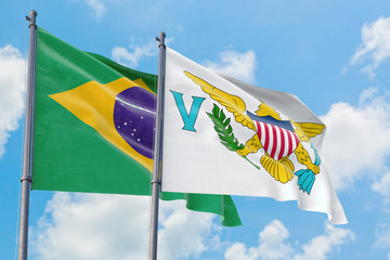 United States Virgin Islands and Brazil flags waving in the wind against white cloudy blue sky together. Diplomacy concept, international relations.