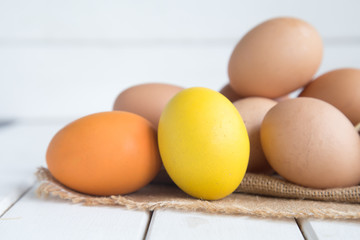 Eggs chicken on white wood background
