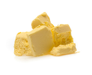 Pieces of butter isolated on white background