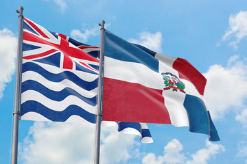 Dominican Republic and British Indian Ocean Territory flags waving in the wind against white cloudy blue sky together. Diplomacy concept, international relations.