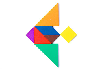 Color wood tangram puzzle in stingray or manta ray shape on white background