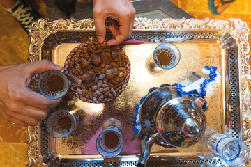 Close Up of People Eating Arab Snack Indoors.