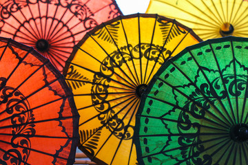 Paper umbrellas on the counter of a souvenir shop in Myanmar