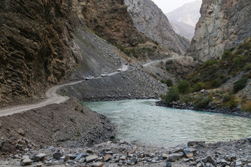 Off-road cars riding mountain serpentine in the Pamir mountains
