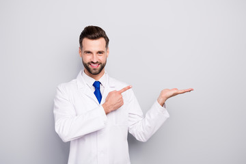 Portrait of his he nice attractive cheerful cheery confident doc holding on palm showing copy space...