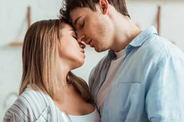 side view of couple with closed eyes